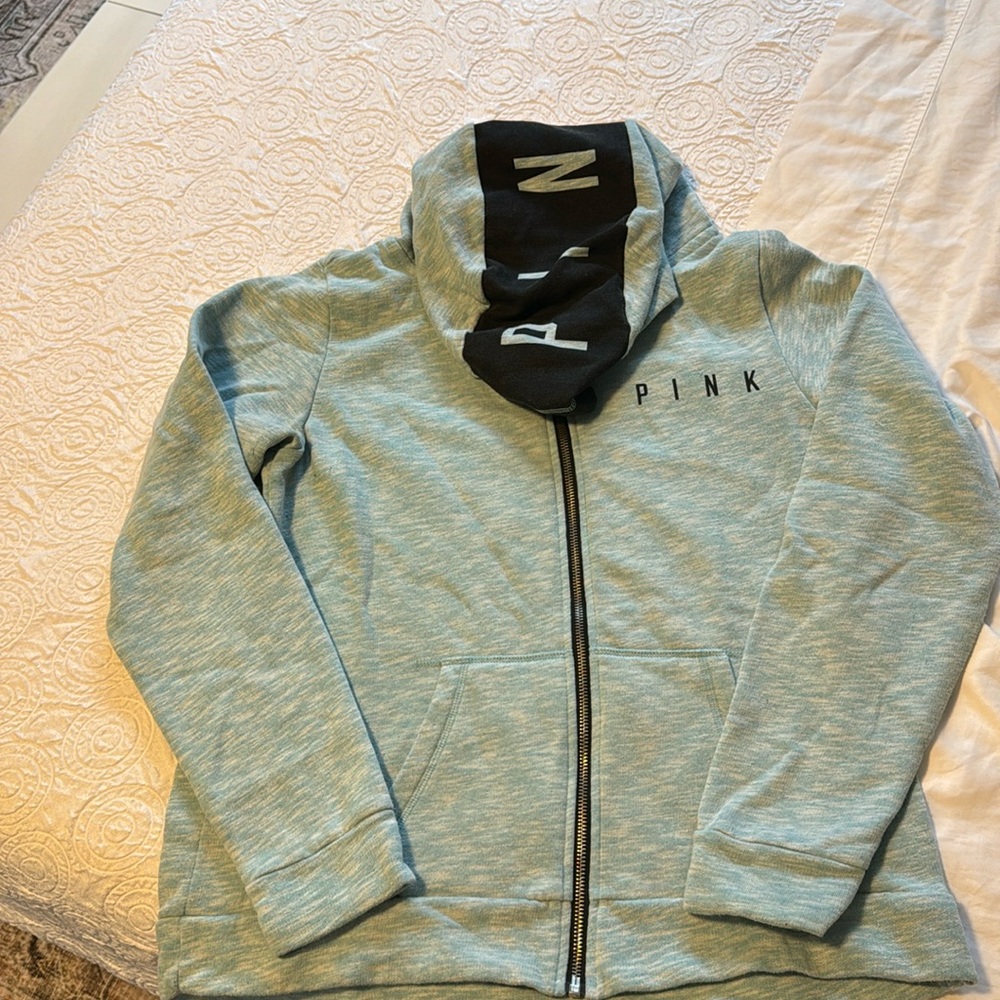 Pink zip up hoodie, light blue. In good condition